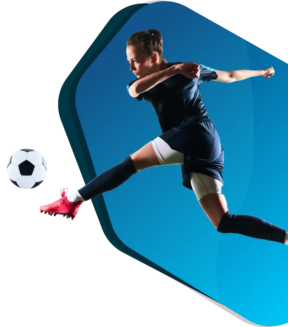 Female player leaping to kick the ball with her left foot